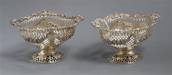 A pair of Victorian pierced silver pedestal bon-bon dishes by Charles Stuart Harris, London, 1993/4, 8.5 oz.